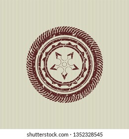 Red ninja star icon inside distress rubber grunge seal