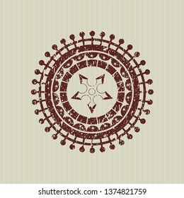 Red ninja star icon inside distressed rubber grunge texture stamp