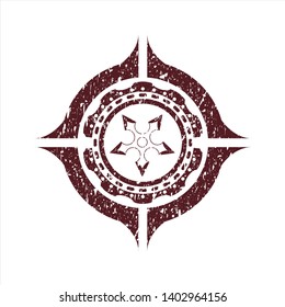 Red ninja star icon inside rubber seal