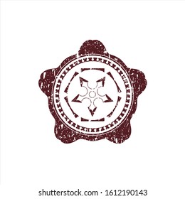 Red ninja star icon inside distress rubber grunge texture seal