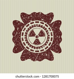 Red nuclear, radioactive icon inside distress with rubber seal texture