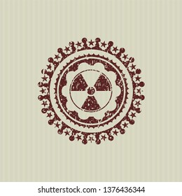 Red nuclear, radioactive icon inside distress rubber grunge texture seal