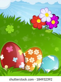 Red, orange and blue painted Easter eggs with abstract pattern  in the meadow
