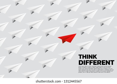 red origami paper airplane in group of white. Business Concept of think different and vision mission.