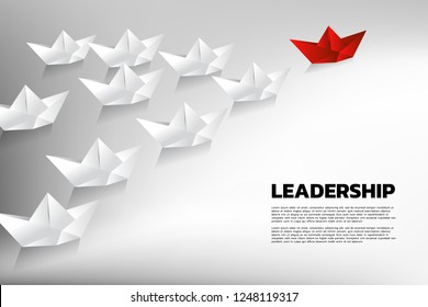 Red origami paper ship leading the group of white. Business Concept of team leadership.