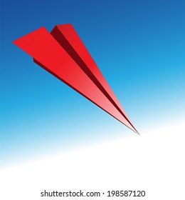 Red paper airplane against the blue sky.