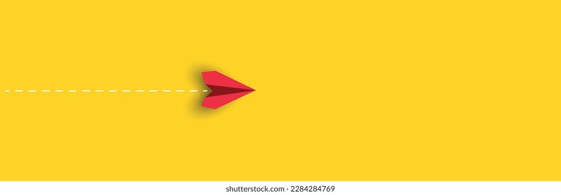 red paper airplane is flying on yellow background.
new job, walking alone, idea concepts.