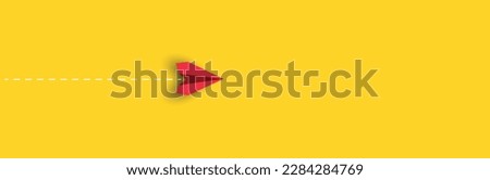 red paper airplane is flying on yellow background.
new job, walking alone, idea concepts.
