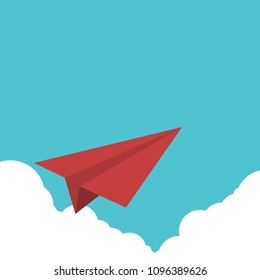 Red paper airplane flying over clouds