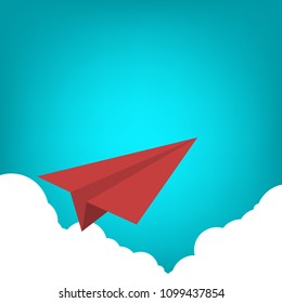 Red paper airplane flying over clouds