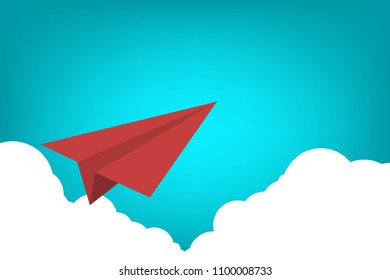 Red paper airplane flying over clouds