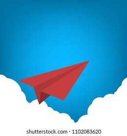Red paper airplane flying over clouds