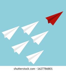 Red paper airplane as a leader among white airplanes, leadership, teamwork, motivation, stand out of the crowd concept.