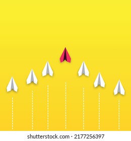 Red paper airplane leads the white paper airplanes. concept of new idea, change, trend, courage, creative solution, innovation.
leadership idea concept.