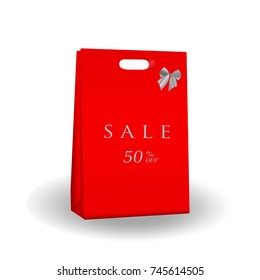 Red paper bag with  text on it: SALE and 50% off .Sale concept.