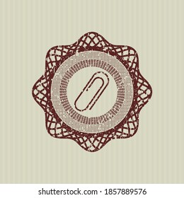 Red paper clip icon inside distress grunge stamp. 