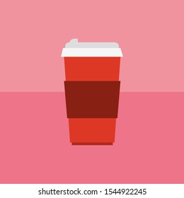 Red paper cup on a pink background