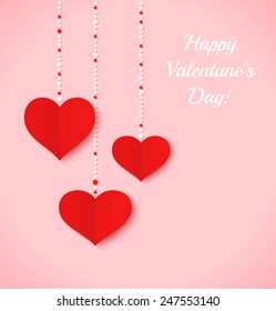 Red paper hearts and color dots on pink background. Valentine's day card or background.
