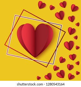 Red paper hearts on a yellow background in frame. Greeting card