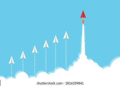 Red paper jet plane leading white airplanes above clouds in the sky. Business leadership concept.