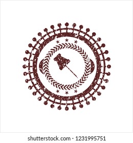 Red paper pin icon inside grunge stamp