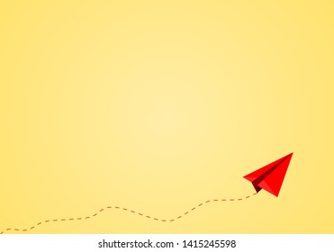 Red paper plane flying with dotted line route on yellow background. Travel or business concept.