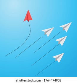 red paper plane lead grey ones on a sky background. Leadership  teamwork.