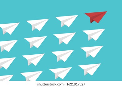 Red paper plane lead white ones on a sky background. Leadership, teamwork. 
