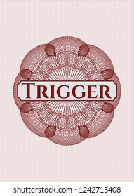 Red passport money style rossete with text Trigger inside