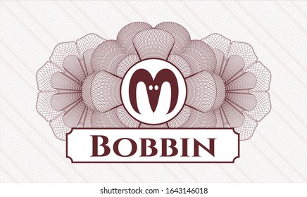 Red passport rosette with goat head icon and Bobbin text inside