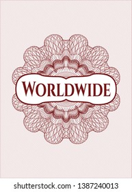 Red passport style rosette with text Worldwide inside