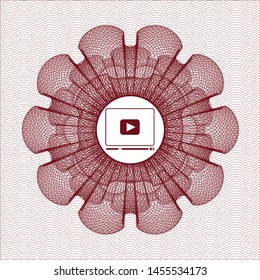 Red passport style rosette with video player icon inside