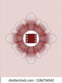 Red passport style rossete with film icon inside