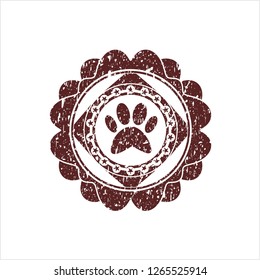Red paw icon inside distressed grunge stamp