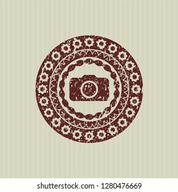 Red photo camera icon inside distress grunge stamp