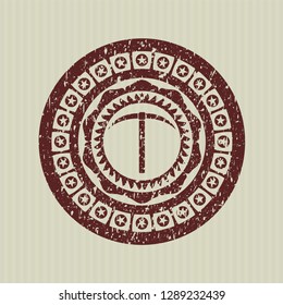Red pickaxe icon inside distress grunge stamp