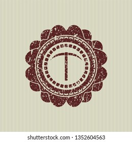 Red pickaxe icon inside distressed rubber grunge texture stamp