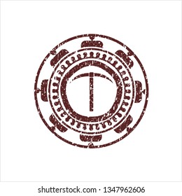 Red pickaxe icon inside rubber stamp with grunge texture