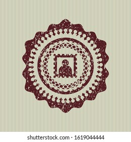 Red picture icon inside distressed rubber seal