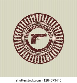 Red pistol icon inside rubber stamp