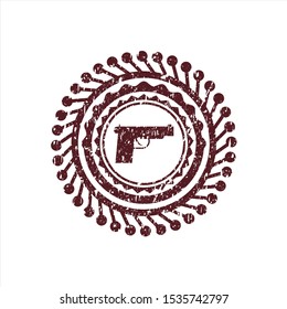 Red pistol icon inside rubber stamp