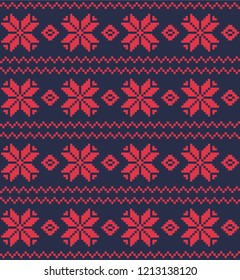 Red pixel snowflakes and zigzags on a dark blue background. Seamless pattern