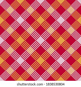 Red plaid Christmas sweater pattern. Seamless checkered knitted pattern tartan, plaid, diamond. Classic red, white and yellow winter knitted texture backdrop.