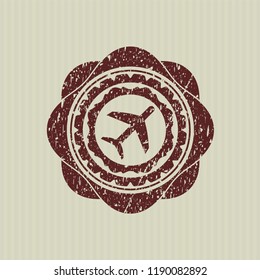 Red plane icon inside distressed grunge stamp