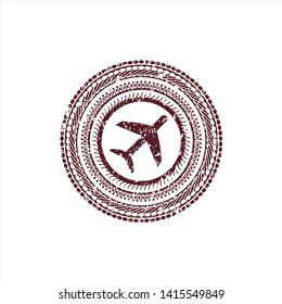 Red plane icon inside rubber grunge texture stamp