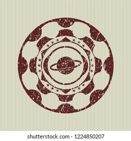 Red planet, saturn icon inside rubber seal