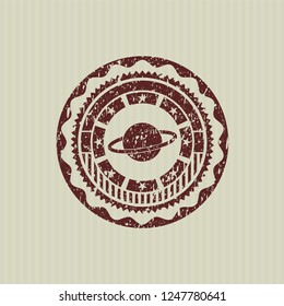 Red planet, saturn icon inside distressed rubber stamp