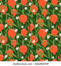 Red Pomegranate seamless pattern with green leaves. Floral vector illustration for SHANA TOVA greeting card. Rosh Hashanah Greeting Card, holiday symbol a pomegranate. Flower and fruits flat vector
