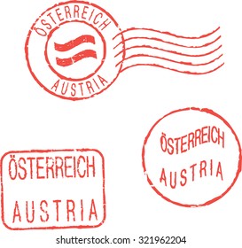 Red postal stamps 'AUSTRIA'. English and german inscription.