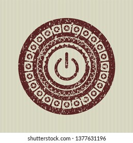 Red power icon inside distressed rubber grunge stamp